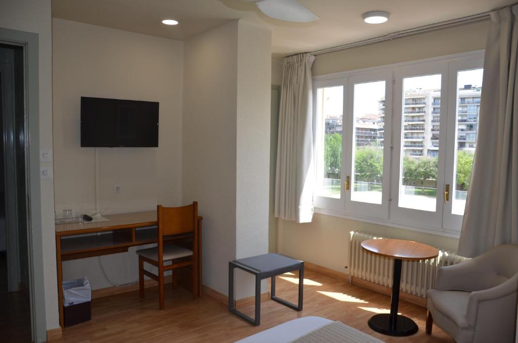 TV a/nebo společenská místnost v ubytování Hotel Balaguer