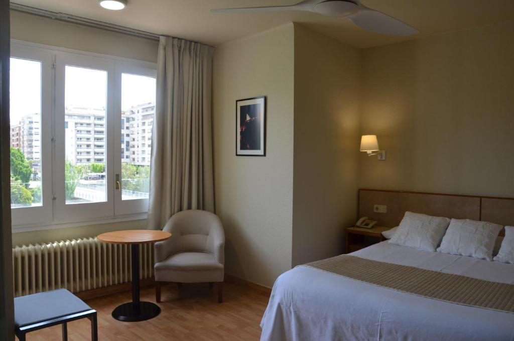 Postel nebo postele na pokoji v ubytování Hotel Balaguer