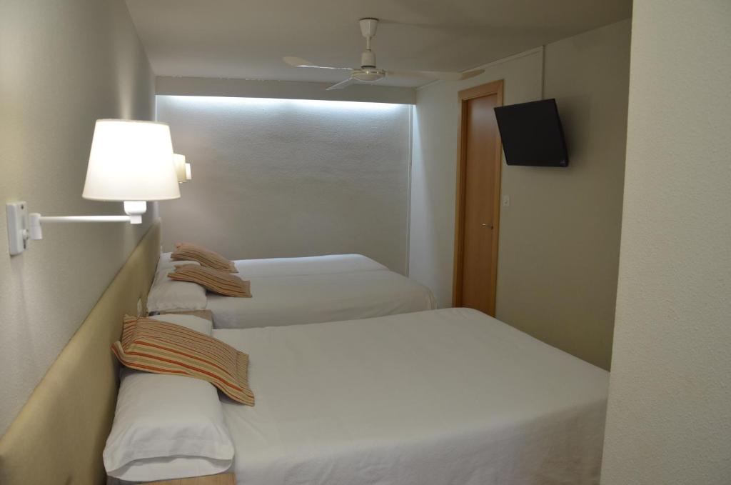 Postel nebo postele na pokoji v ubytování Hotel Balaguer