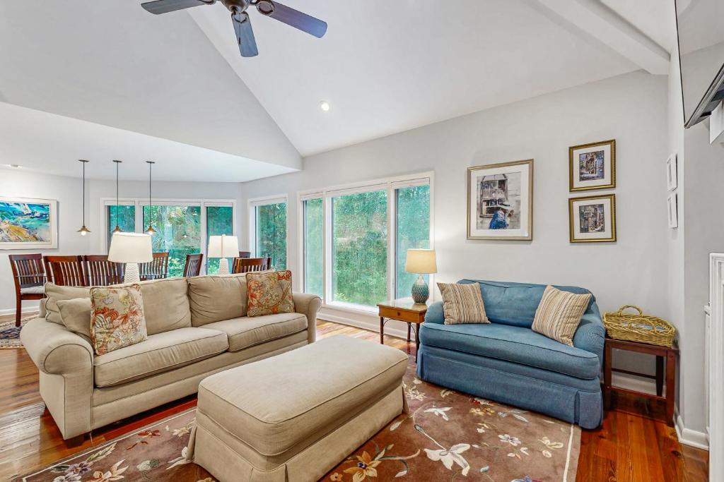 a living room with a couch and a chair at Spinnaker 780 in Seabrook Island