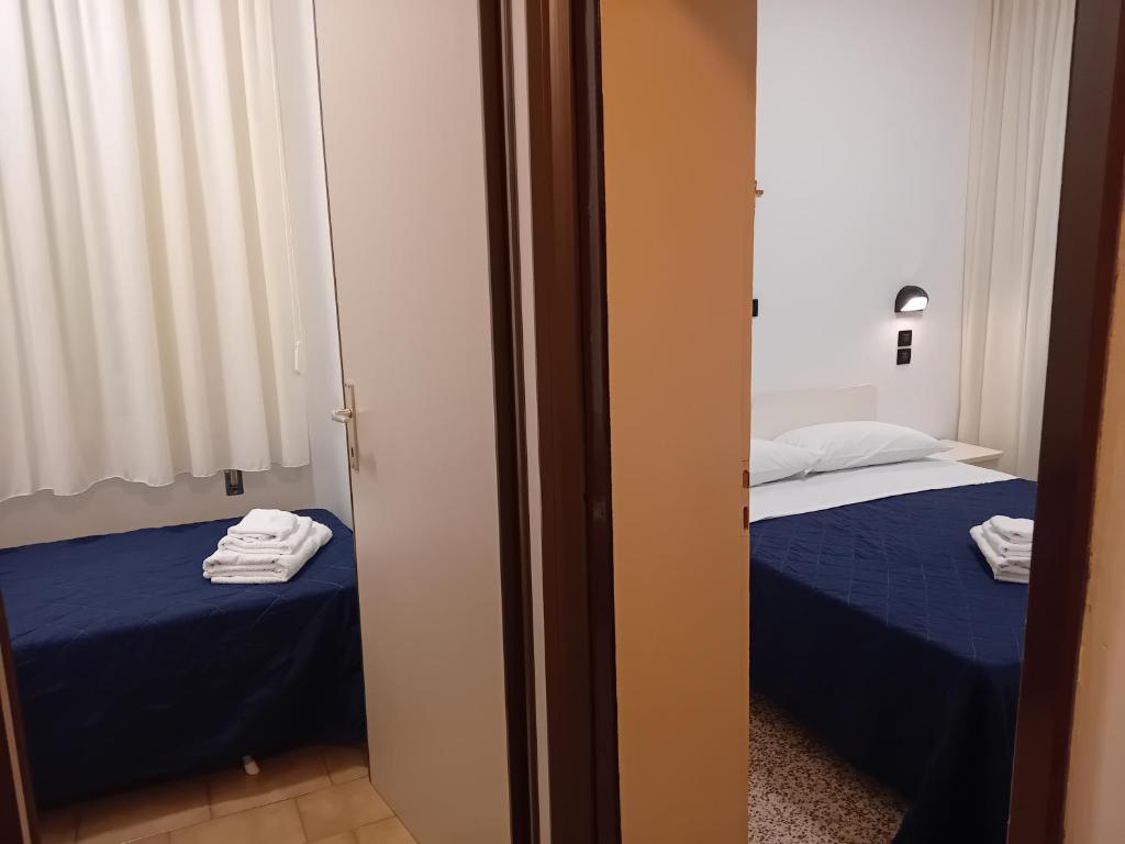 Postel nebo postele na pokoji v ubytování Hotel Mira