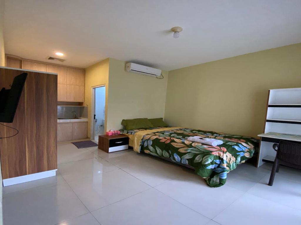 Postel nebo postele na pokoji v ubytování Homestay Sentul Bogor