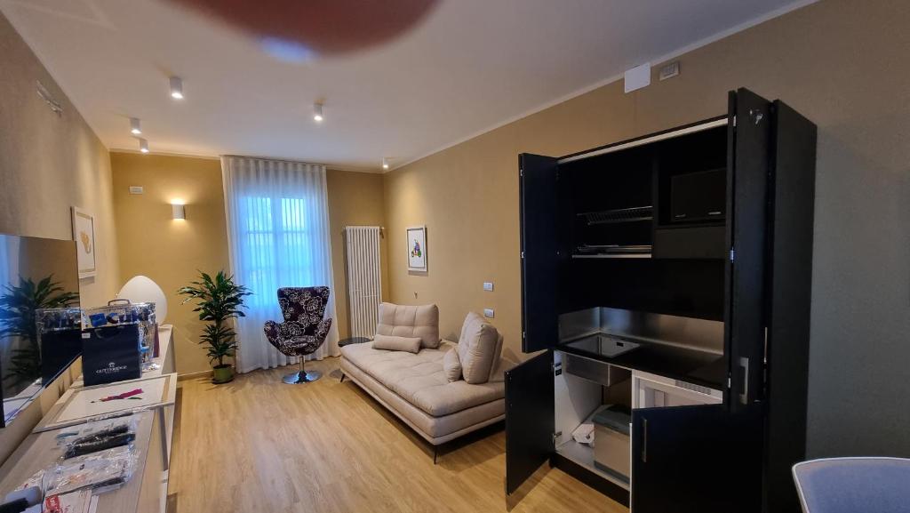 TV a/nebo společenská místnost v ubytování Albergo Trieste Boves - Ricetto Suite