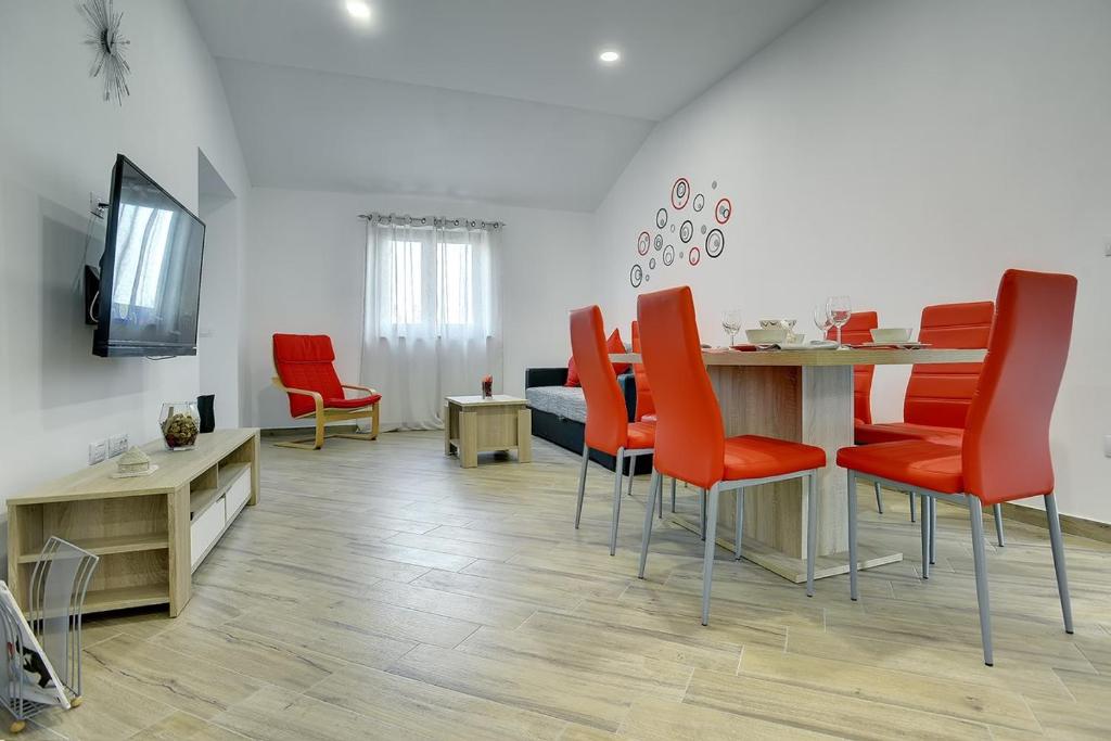 TV a/nebo společenská místnost v ubytování Villa Mareti