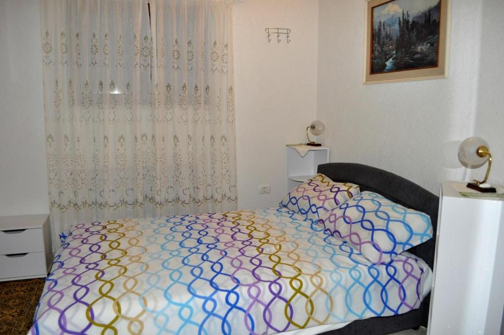 Łóżko lub łóżka w pokoju w obiekcie Holiday Home Monte Maggiore