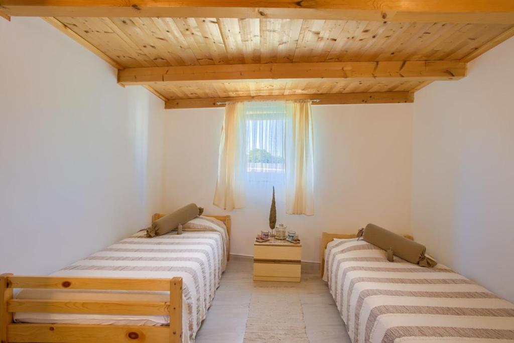Postel nebo postele na pokoji v ubytování Holiday Home Michelle