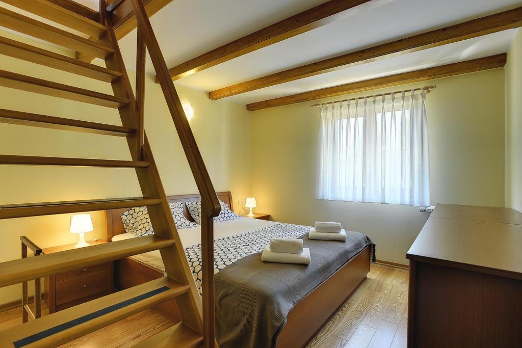Postel nebo postele na pokoji v ubytování Villa Maria Betiga