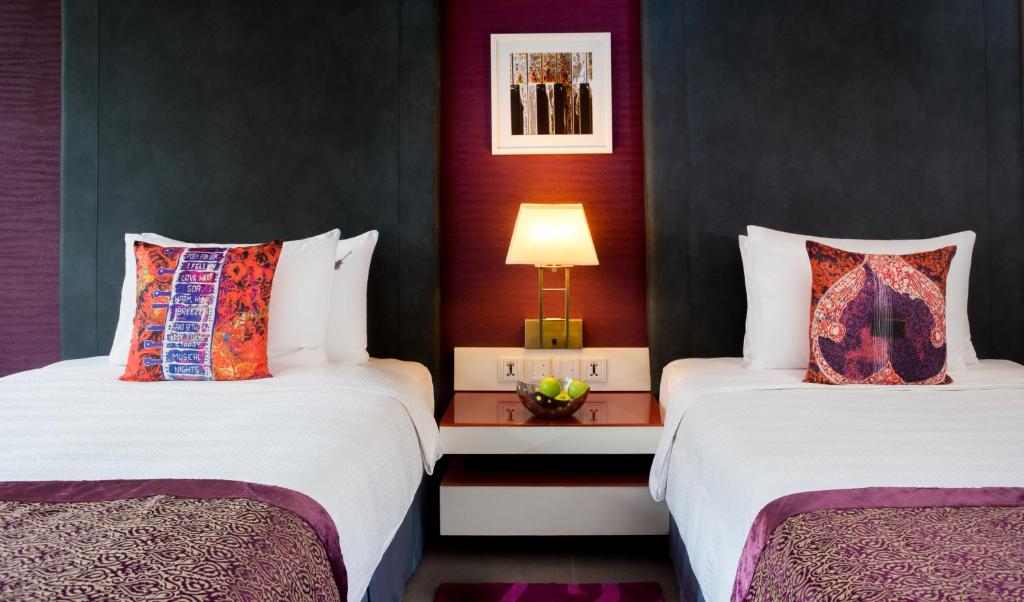 Postel nebo postele na pokoji v ubytování Hard Rock Hotel Goa Calangute