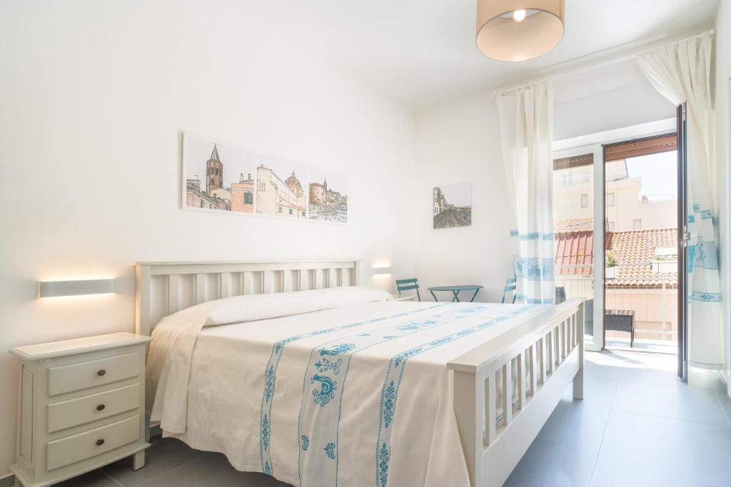 Postel nebo postele na pokoji v ubytování B&B S'Unda Jara