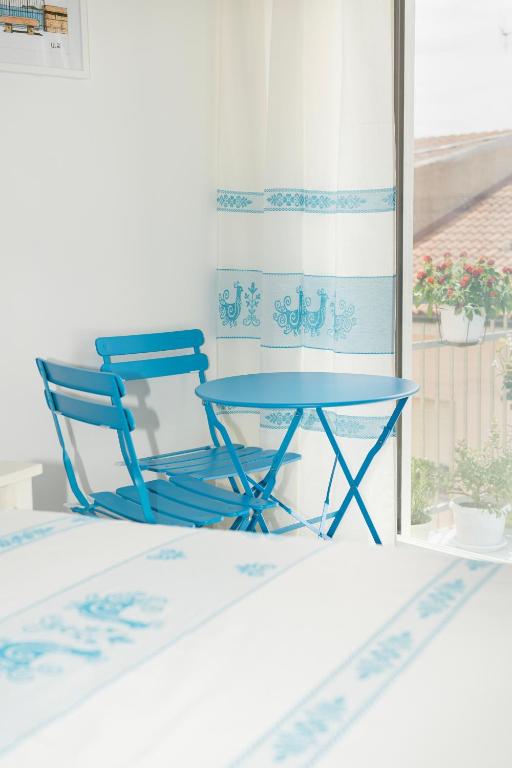 Postel nebo postele na pokoji v ubytování B&B S'Unda Jara