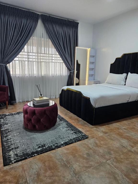 Postel nebo postele na pokoji v ubytování Pearl Homes