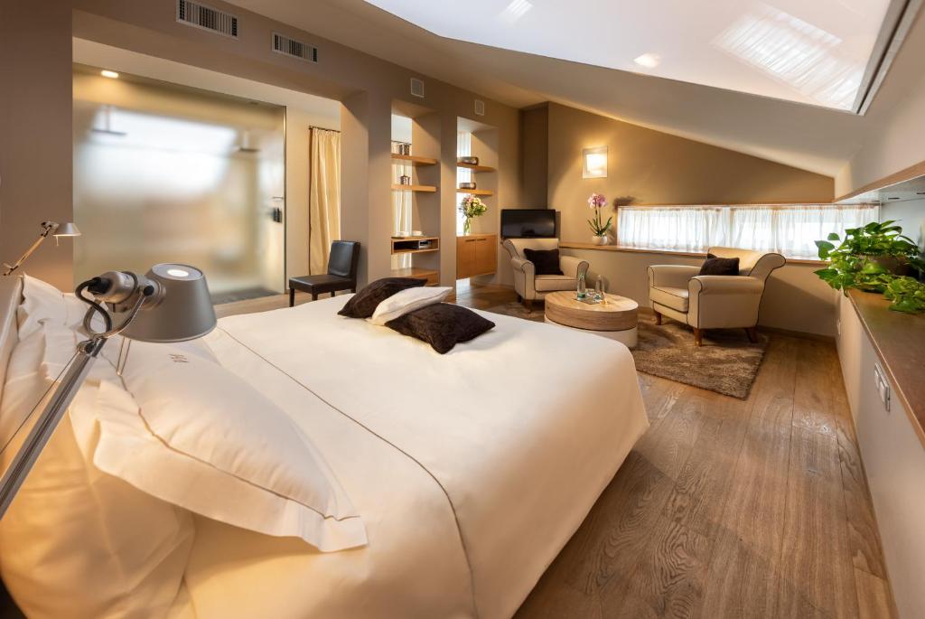 Postel nebo postele na pokoji v ubytování Relais Villa D'Amelia