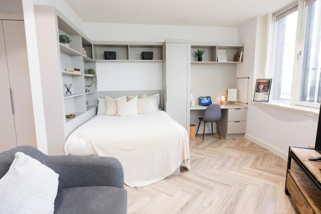 Postel nebo postele na pokoji v ubytování City HideAway