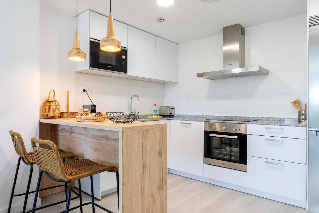 Kuchyňa alebo kuchynka v ubytovaní Hauzify I Apartaments Roques Daurades