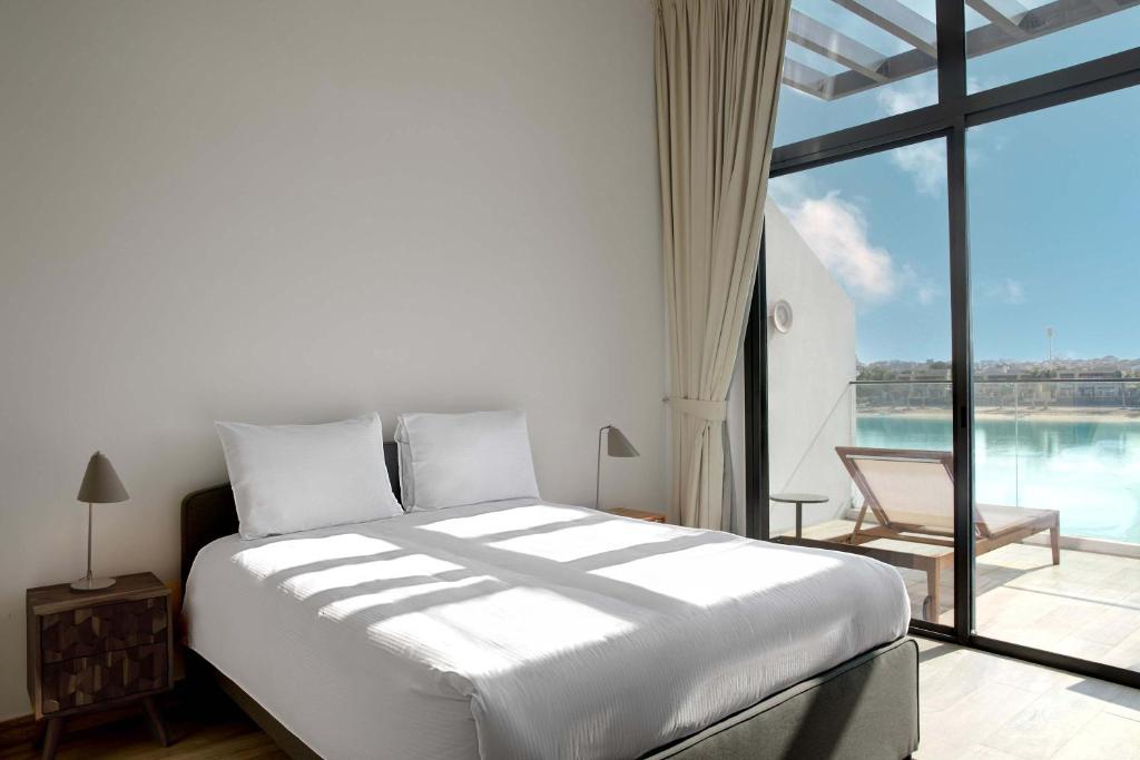 Voodi või voodid majutusasutuse Beach Villas by Olala Homes toas