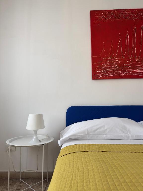 Postel nebo postele na pokoji v ubytování Giove Rooms