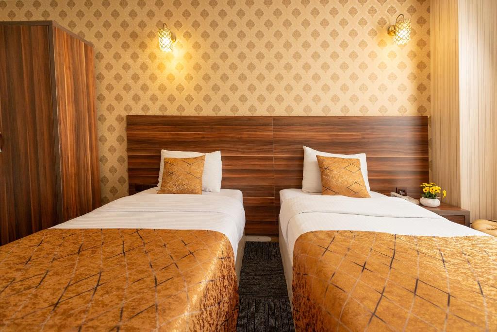 Postel nebo postele na pokoji v ubytování Niva Atakum Otel