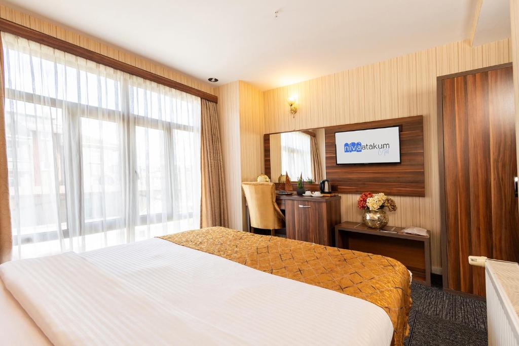 Postel nebo postele na pokoji v ubytování Niva Atakum Otel