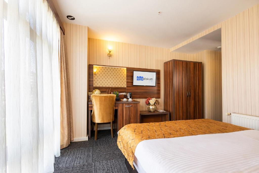 Postel nebo postele na pokoji v ubytování Niva Atakum Otel