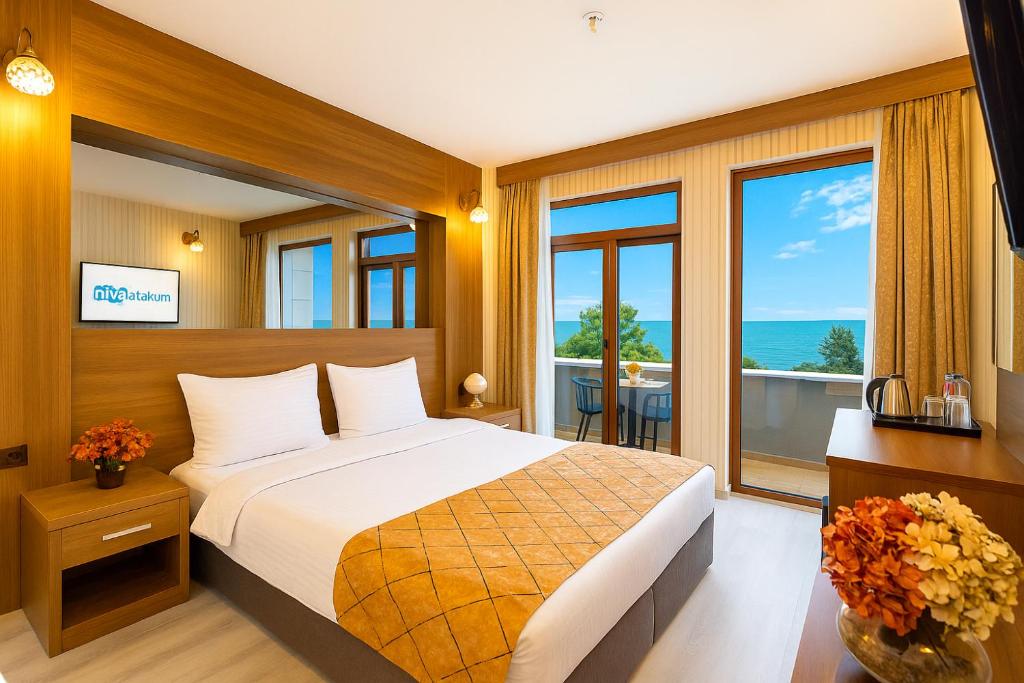 Postel nebo postele na pokoji v ubytování Niva Atakum Otel