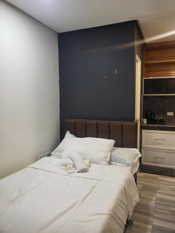 Postel nebo postele na pokoji v ubytování The Hive Staycation
