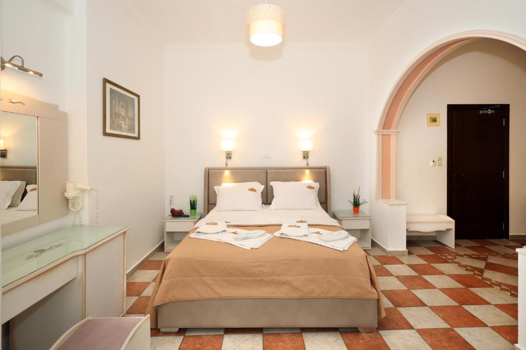 Postel nebo postele na pokoji v ubytování Hotel Klonos - Kyriakos Klonos