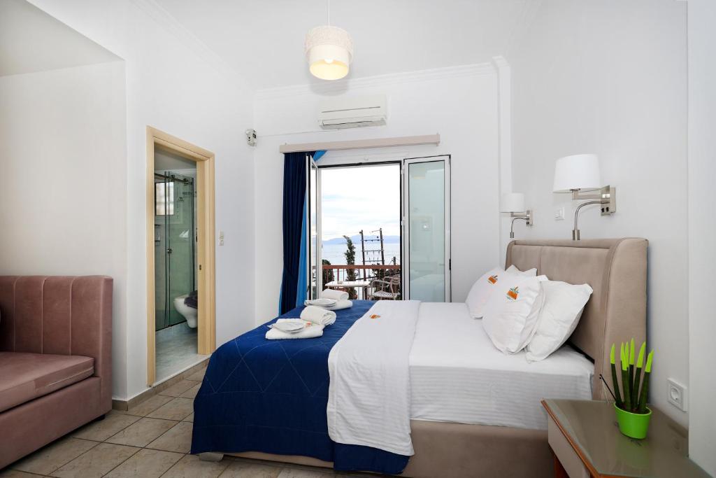 Postel nebo postele na pokoji v ubytování Hotel Klonos - Kyriakos Klonos