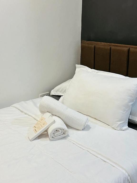 Postel nebo postele na pokoji v ubytování The Hive Staycation