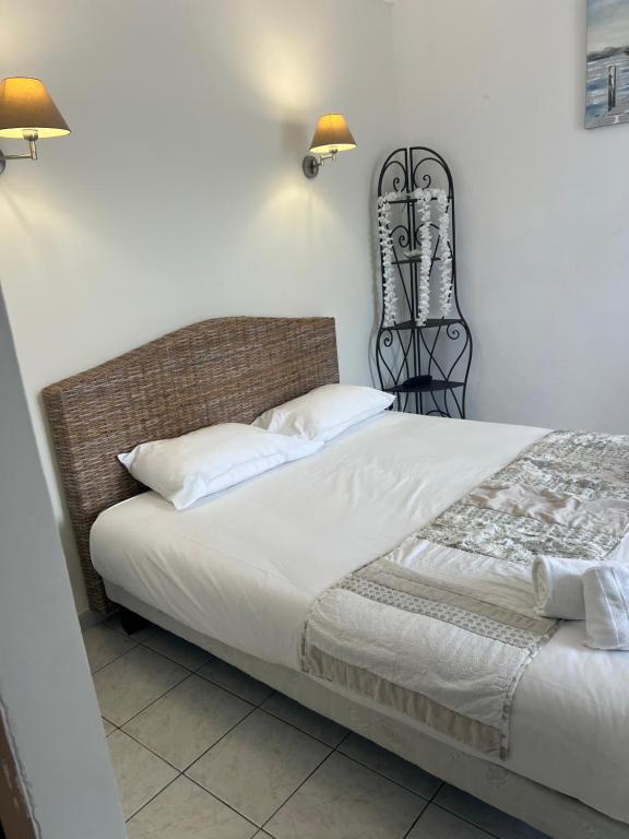 Postel nebo postele na pokoji v ubytování Hôtel Restaurant le Bellevue