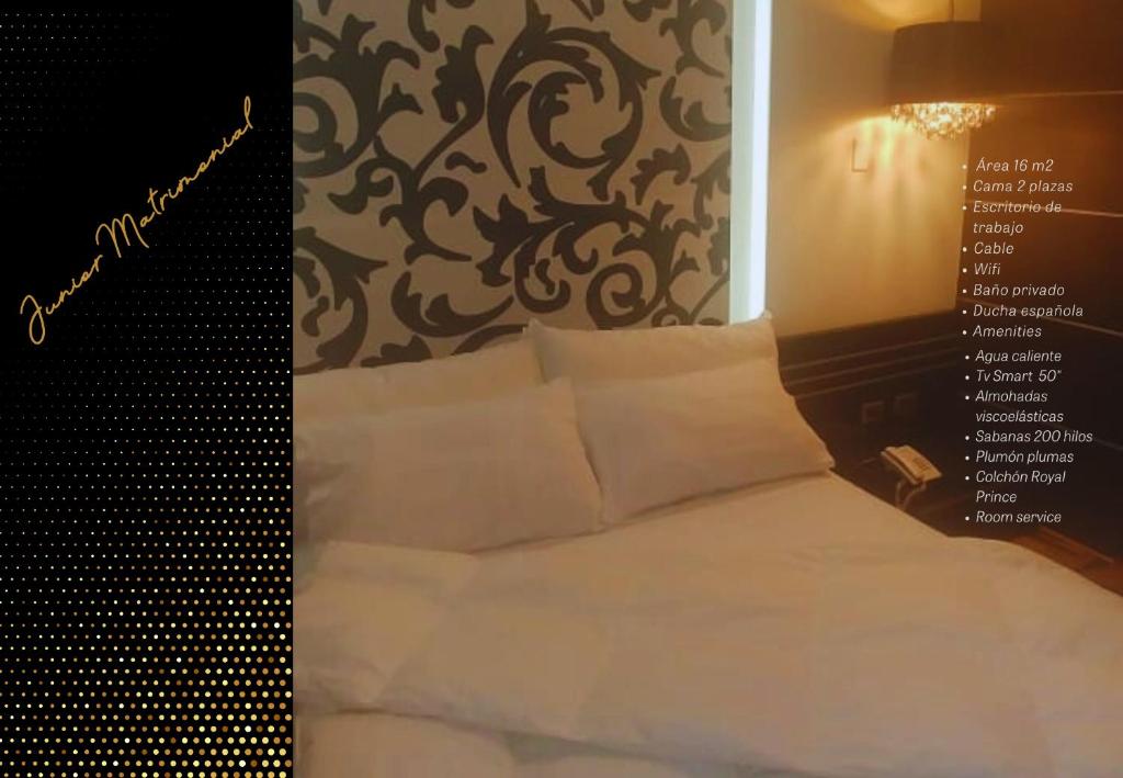 Postel nebo postele na pokoji v ubytování hotel taymi