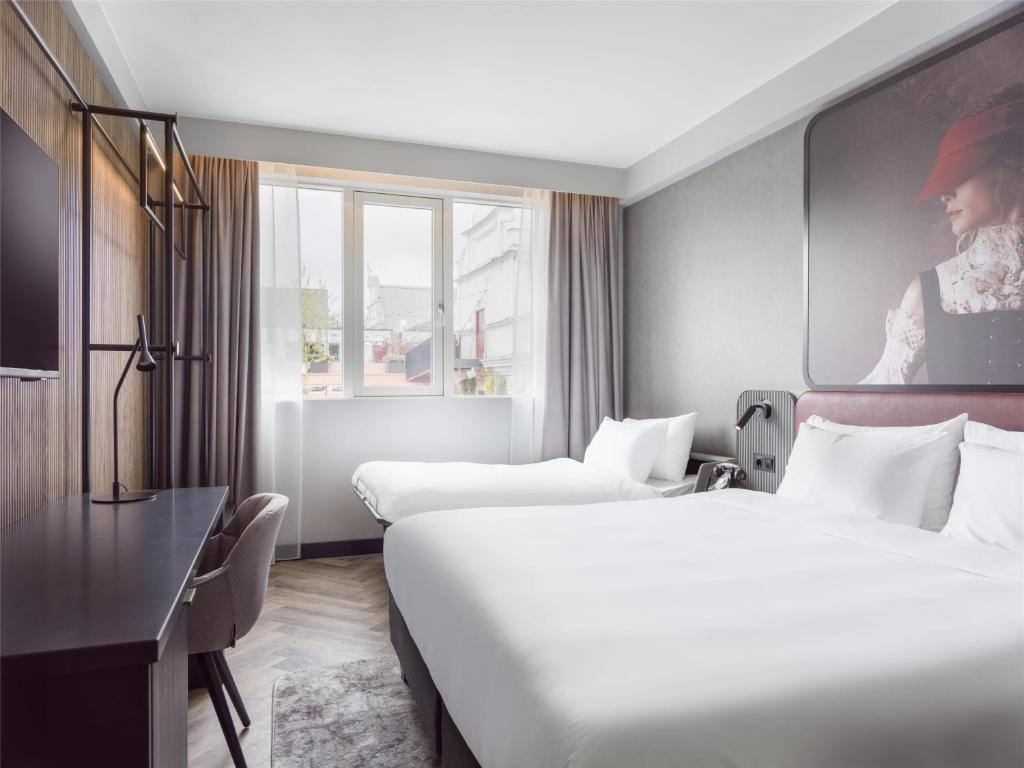Postel nebo postele na pokoji v ubytování Radisson RED Oslo City Centre