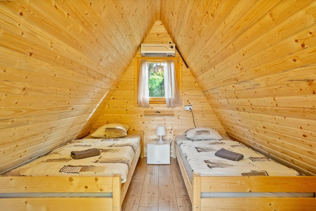 Letto o letti in una camera di Resort pod orehi - Bled - Apartma & Glamping & Savna