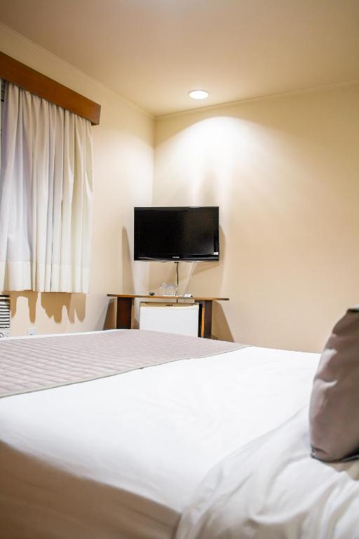 TV a/nebo společenská místnost v ubytování Radio Hotel Resort & Convention