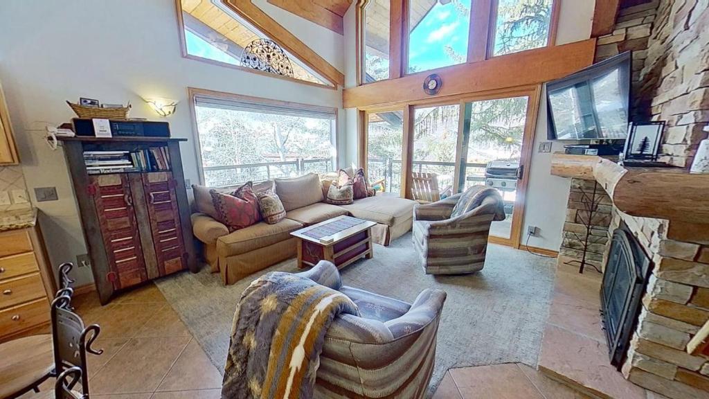 a living room with a couch and a fireplace at Crestwood 3304 Premier 1 Bedroom Plus Loft in Snowmass Village