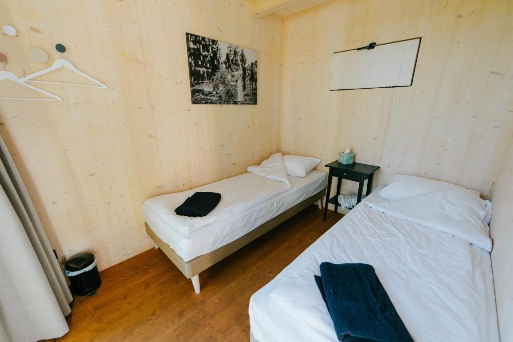 Postel nebo postele na pokoji v ubytování TRESKI Ö-majakesed