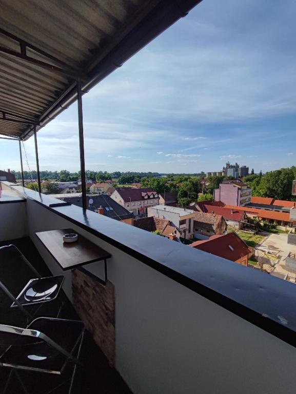 a balcony with a view of a city at Studio apartman Trg in Županja