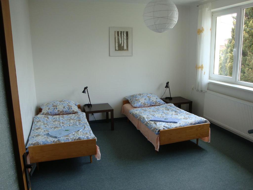 Postel nebo postele na pokoji v ubytování Apartmán Wolkrovka