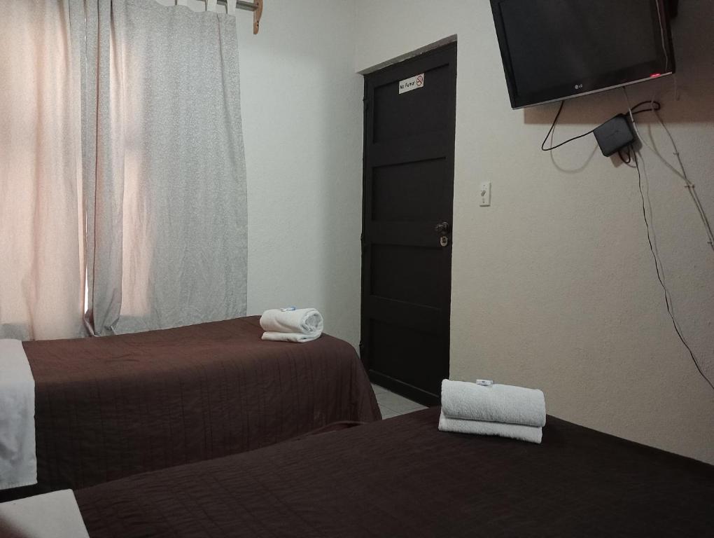 Postel nebo postele na pokoji v ubytování Residencia San Pablo