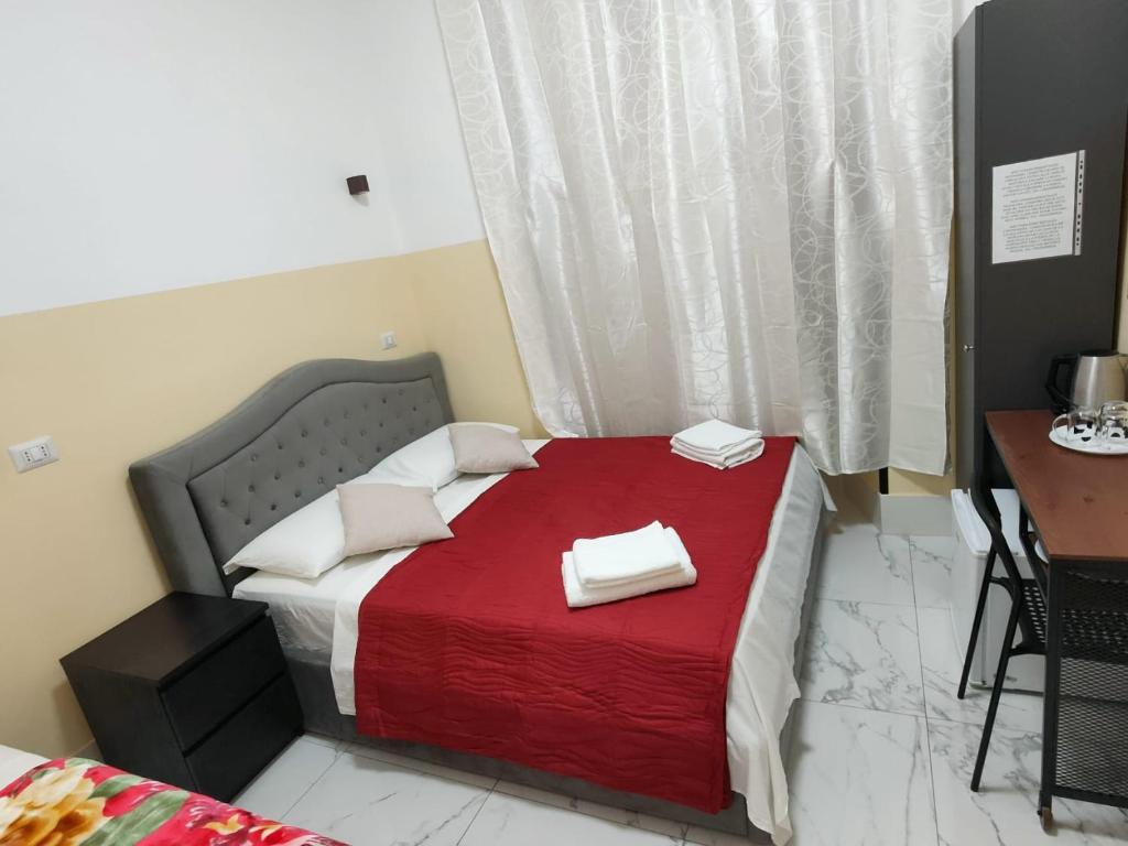 Postel nebo postele na pokoji v ubytování RATTAZZI ROMA CENTRo