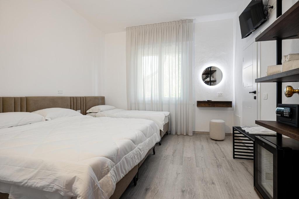 Postel nebo postele na pokoji v ubytování Hotel Levante Cesenatico