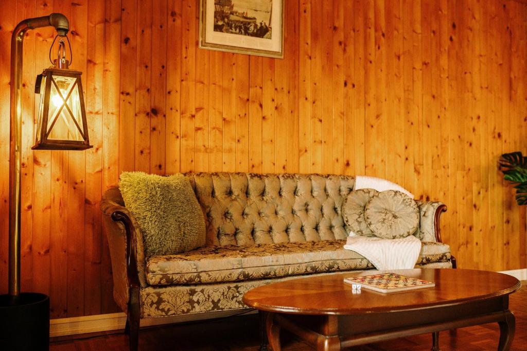 a living room with a couch and a table at Albert's in Shelburne