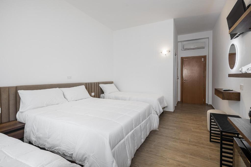 Postel nebo postele na pokoji v ubytování Hotel Levante Cesenatico