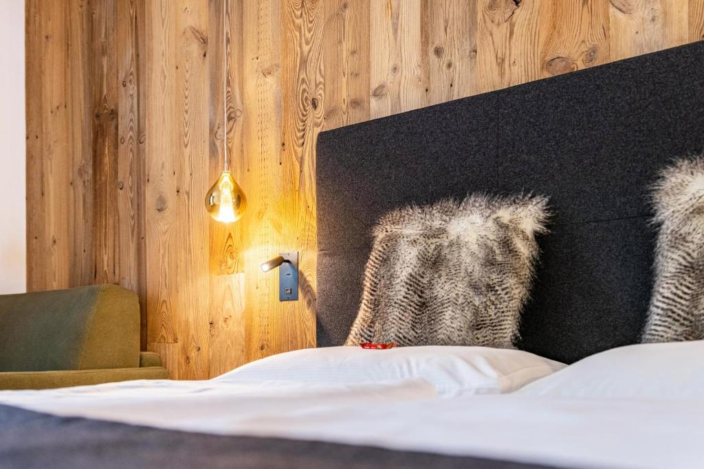 Postel nebo postele na pokoji v ubytování Chalet Ortles Apt ll