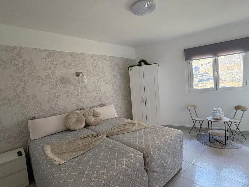 Postel nebo postele na pokoji v ubytování G&T loft pensión candelaria