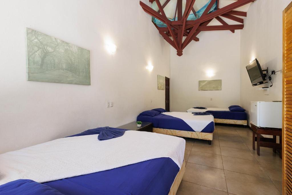 Postel nebo postele na pokoji v ubytování Bambutel Cocles