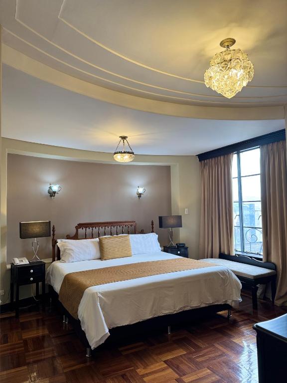 Postel nebo postele na pokoji v ubytování Hotel Nutibara