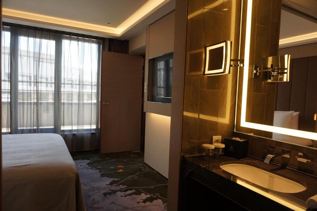 Postel nebo postele na pokoji v ubytování Tangla Hotel Brussels