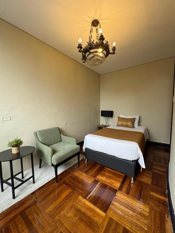 Postel nebo postele na pokoji v ubytování Hotel Nutibara