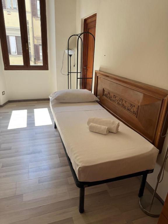 Ένα ή περισσότερα κρεβάτια σε δωμάτιο στο Il Pellegrino Guesthouse