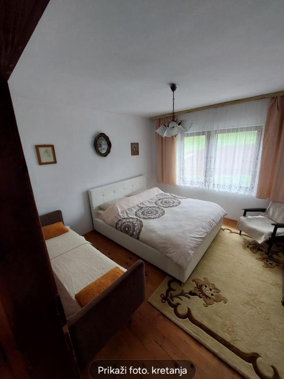 Postel nebo postele na pokoji v ubytování Vlajka